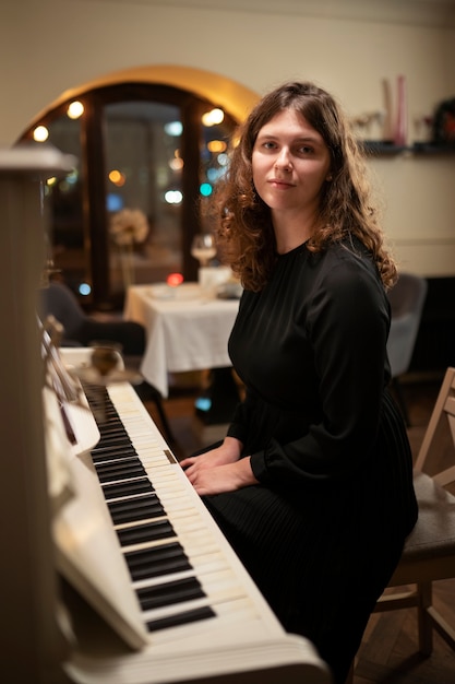 Voice student practicing scales and pitch accuracy during individual singing instruction session